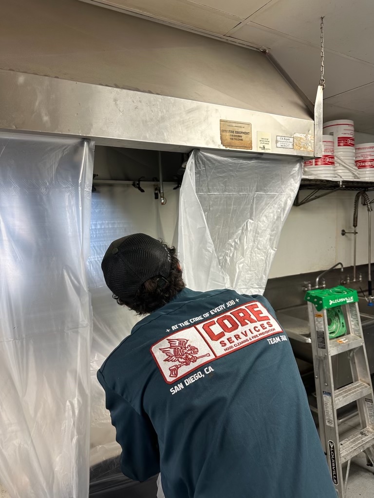 Hood cleaning technician at work